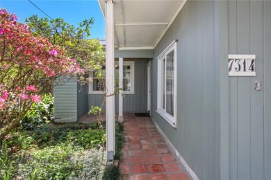Exterior is wood and hardy plank with covered walk