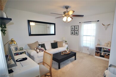 Living room with light colored carpet and ceiling