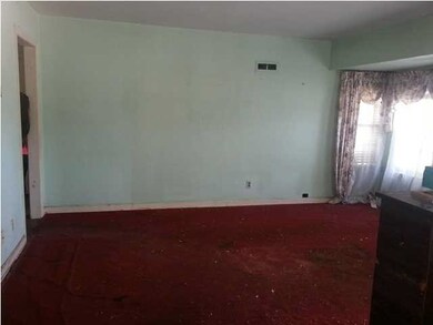 Living area, possible wood floor underneath.