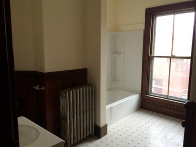 Remodeled bath is large and bright.