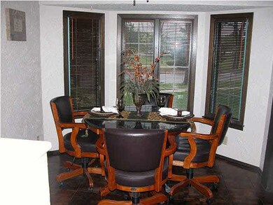 Casual dining area has beautiful wood parkay floor