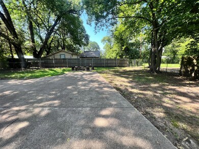 Long concrete drive with two or more parking areas