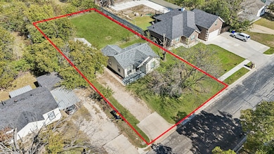Aerial view of property and surrounding area with property boundaries highlighted