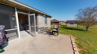 Back Porch is covered and screened in.  Lets you g