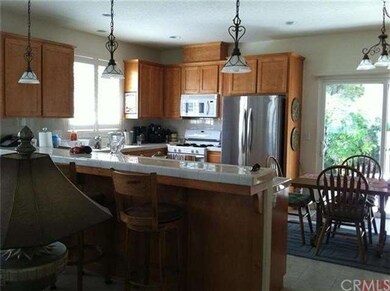 Raised tiled bar, separates kitchen and dining/liv