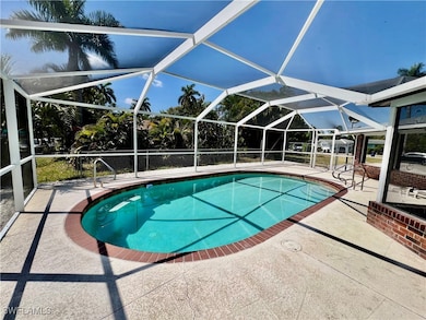 Pool with a patio area and screen enclosure