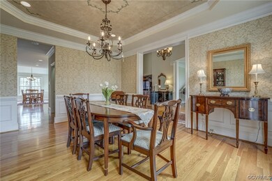 To the left of the front door lies the elegant din