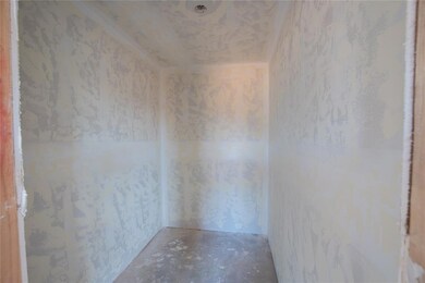 Spare room featuring concrete flooring