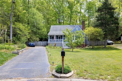 Driveway to 2 story Cape Home