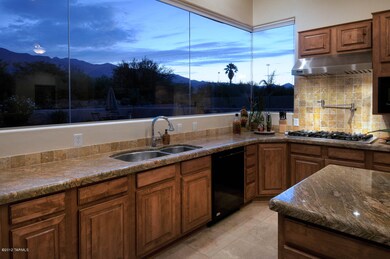 Kitchen looking out to pool, spa & mnts