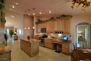 Kitchen showing Built-in Desk and TV