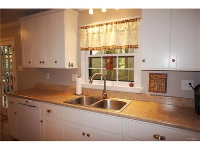 The kitchen has natural light from the windows as 