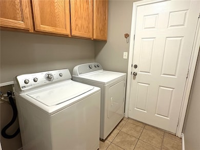 Laundry room with cabinet space, independent washe