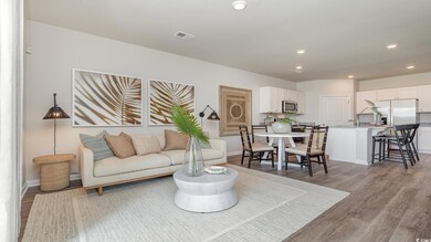 Living room with hardwood / wood-style flooring