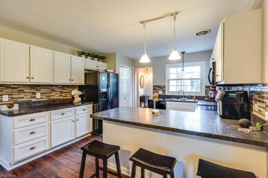 Kitchen with black dishwasher, a center island, da