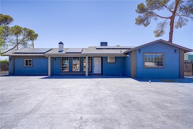 View of front of property with a chimney, roof mou