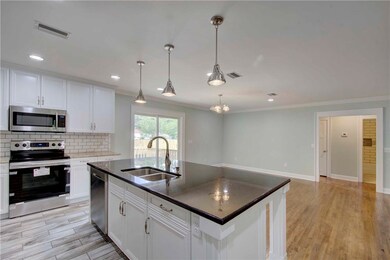 Kitchen view into dining area.  2019 Photos