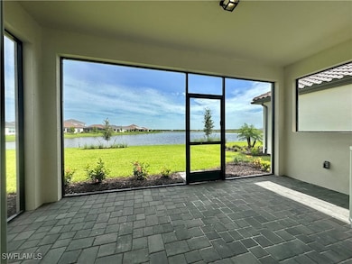 Unfurnished sunroom with a water view
