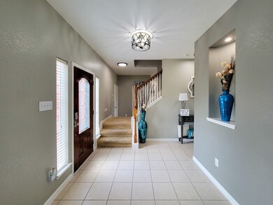 Foyer is very spacious and has 2 ways of heading upstairs.