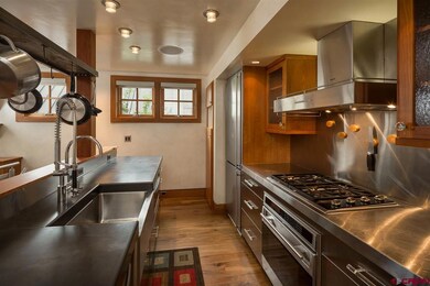 GOURMET KITCHEN WITH STAINLESS STEEL APPLIANCES AN
