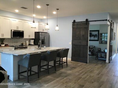 KITCHEN WITH VIEW OF 3RD BEDROOM