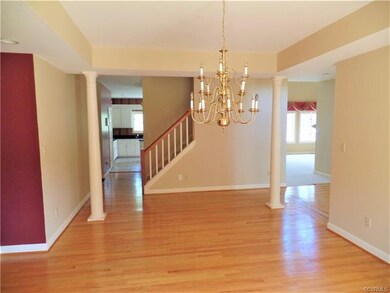 The dining room also features a tray ceiling, wood