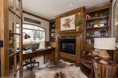 Office with new hardwood floors and custom built-ins.
