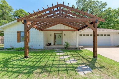 View of front of home featuring brick siding, an 