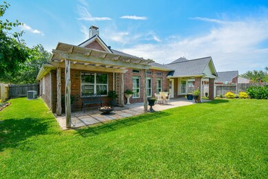 Extended Patio with Pergola and luscious landscaping to make this space quite the retreat after a long day!