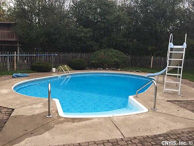 Pool In Ground. The pool has a slide and the pool 