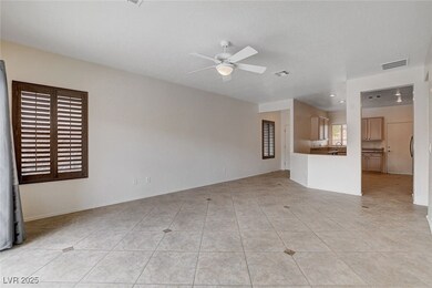 Unfurnished living room with a sink, ceiling fan,