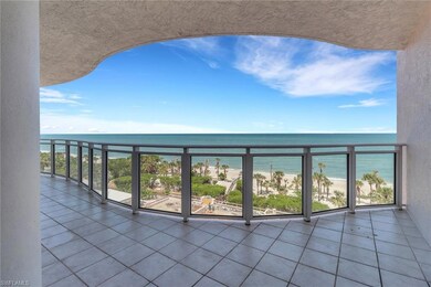 Balcony with view of water and beach