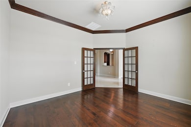 Office featuring crown molding, hardwood flooring,
