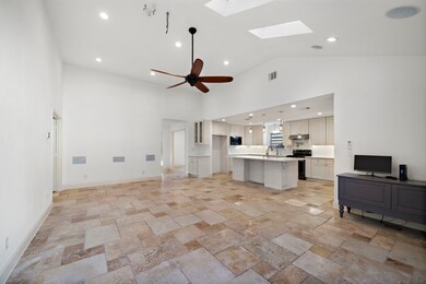 Living room with high ceiling. Pre wired 7.1 surround system include speakers. Wired security camera system include.