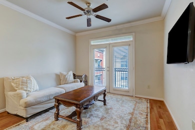 Natural light streams through French doors with bl