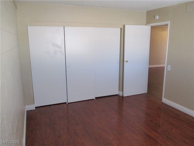 Unfurnished bedroom featuring wood finished floors