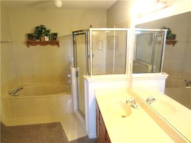 The master bath includes a whirlpool tub, separate