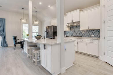 Kitchen with stainless steel appliances, under ca