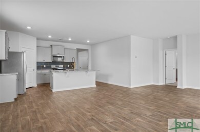Open concept floor plan with kitchen open to great