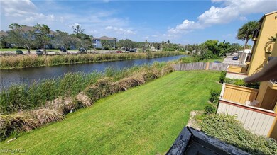 View of yard with fence and a water view