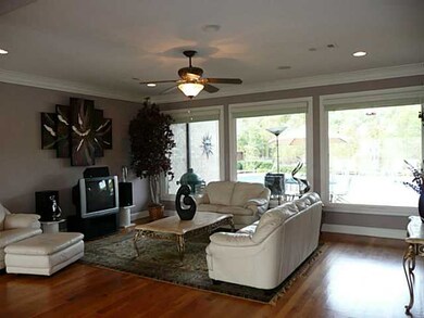 Living Room looks out to Inground Pool