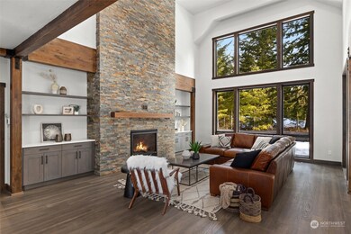 Great Room with built in cabinets and stone fireplace