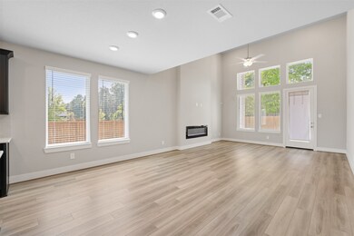 Open concept loving space with high ceilings and a