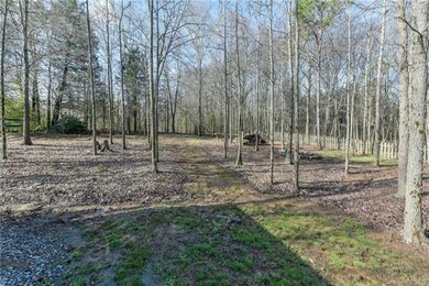 Backyard - wooden lot, fire pit, horseshoes