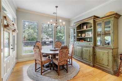 Pretty Dining room with double French door to porc