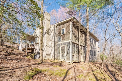 View of side of property featuring a chimney