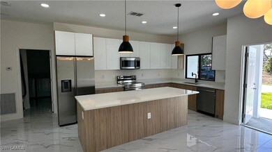 Kitchen with a sink, appliances with stainless ste