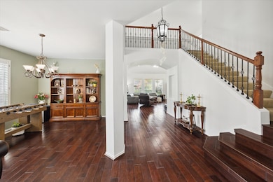 Welcoming entryway with formal dining room to the