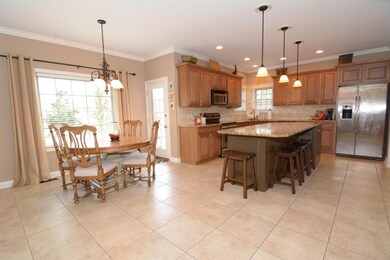 Large well designed kitchen with tile floors and g