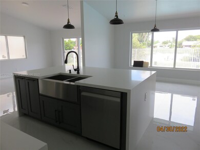 KITCHEN LOOKING OUT TO BACK YARD